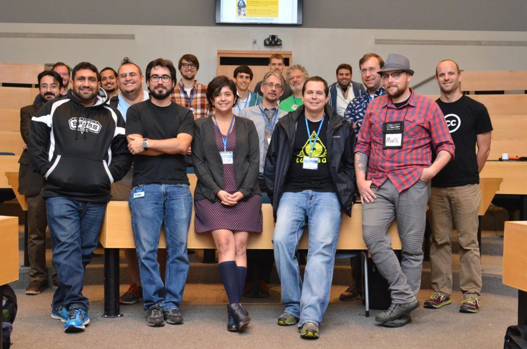 This is a photo of some of the attendees at Libre Learn Lab, all posing to take the photo with s a smile. Except me (standing in the middle), they are all men. Women were present at the conference, but all happened to leave earlier than this photo was taken.